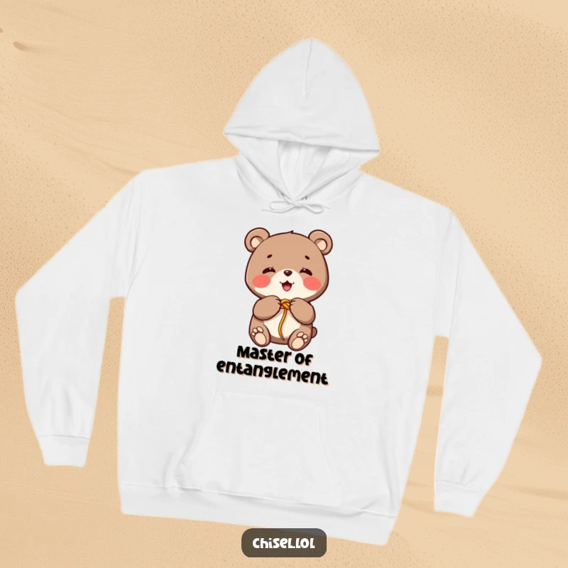 Funny Kawaii bear hoodie showing a giggling character tying a colorful string knot with its paws, ideal for a humorous present.